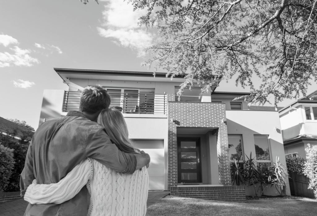 Couple looking at their new house